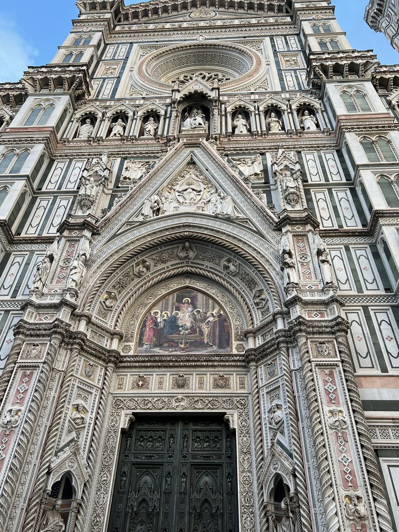 The central portal and the rose window above it